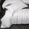 Set di biancheria da letto set di cotone a strisce verticali bianche ricamo copripiumino 4pcs morbido lussuoso lussuoso moderno foglio letto foglio