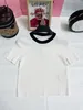 Spring and summer new knitted short sleeved classic round neck contrasting color design