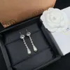 Designer Mui Mui Jewelry Family Miao Familys New Full Diamond Pearl Long Tassel Earrings for Women French Elegant Temperament Small Group Silver Needle