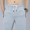 Pantalon masculin masculin zipper poche extension décontractée droite lâche mince respirant pantalon de sport printemps d'été élastique