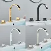 Robinet de bassin de salle de bain doré poli en laiton robinets d'évier répandus à deux poignées à double poignée montée à eau chaude et à eau froide