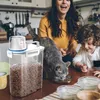 Bottiglie di stoccaggio cereali per cucina e cereali secchio di riso portatile con alimento di plastica a tazza di misurazione