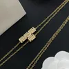 Collier doré des hommes de créateurs de bijoux de bijoux gravés medus diamant pendent collier avec boîte à hip hop colliers pour femmes V bracelet