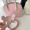 Sac à main en cuir Bolide Sacs de luxe de luxe Sacs mini-sac à main à petit et mignon avec une couche de sac de coquille de vache à la mode et les polyvalents ont le logo hbhhj4