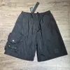 Nya mäns shorts mode lösa mikro elastiska bekväma avslappnade shorts -knappar broderat emblem snabbt torkande herrbyxor