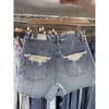 Blue Denim Shorts för kvinnors sommar 2024 Ny lös och bantande mångsidig design med en lapptäcke A-linje breda ben heta byxor