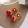 Brincos de bronzeamento feminino INS Flores de luxo de luxo Pearl Zircon Stud Fashion Niche Design de nicho vermelho Pétal