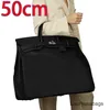 Designer hög kapacitet handväskor 50 cm väska stor väska stor resväska stor kapacitet väska läder resväska dominerande män wn-btg0