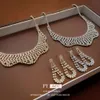 Echte gouden geëlektroplateerde zirkoongolfketting tweedelige set, Koreaanse gepersonaliseerde lichte sleutelbeenketting, elegant temperament, nieuwe kettingen