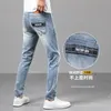Jeans masculin printemps d'été mince masculin slim slim américain calicon marque haut de gamme petit pantalon droit Q9576-00