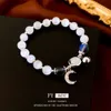 Diamond Moon Bell's Cat's Eye Stone Breded Bracelet avec petit et frais de design de mode, de nouveaux bijoux artisanaux polyvalents pour les femmes