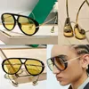 Luksusowe kobiety projektantki owalne okulary przeciwsłoneczne 1273s żółte bio nylonowe soczewki czarne duże ramy octanowe mężczyźni okulary przeciwsłoneczne wisiorki metalowe boku boków okularów 1274S