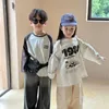 T-shirt 2024 Spring Boys and Girls Cartoon Letters Cotton T Shirts Kids Of Ock Sciose Long Sleeve Tops 240410