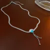 Titanium Steel Turquoise Fan en forme de collier à glands, personnalité de la mode de niche, chaîne de clavicule, sens simple et haut de gamme, collier pour femmes