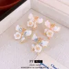 Sier Needle Farterfly Flower Crystal med koreanska insatsörhängen, små och stilörhängen för kvinnor