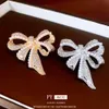 Illusionary Diamond Studded Pearl Bow Brooch with High-end Feel, Sweet Temperament, A Small and Versatile Design Feel Accessory