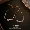 Echte gouden geëlektropleerde zirkoonknoop geometrische armband uit Zuid -Korea, licht, zoete modieuze armband, niche -ontwerp en gevoel voor dames