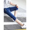 Letnie dżinsy dla męskiej wersji koreańskiej modne cienkie spodnie od średniej do krótkich z małymi nogami, letnie męskie spodnie
