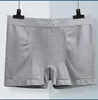 Sous-pants Boxer masculin Lingerie Sexy Ments Shorts confortables Pantalons plats Men Mid Rise Pantalon d'angle sans couture2024