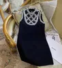 Grundläggande casual klänningar designer kvinnor klänning chunxia tung industri diamant inbäddning klänning lyx ärmlös rund nackklänning, a-line kjol för kvinnor kjol