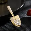 Nouveau minimaliste et mignon petite pelle zircon broche en cuivre broche en cuivre broche anti-monnaie accessoires de broche