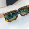 Well-known brand sunglasses Occhiali Symbole PR 06YS mens and womens glasses fashion triangle decoration big temples eye retro Green Stone Pine Mirror Leg