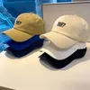 Baseball de beisebol macio de primavera/verão feminino 1987 Edição coreana bordada Instagram Moda Duck Tongue masculino Casual Curvido Hat da moda