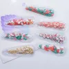 12pcs 60 * 22 mm PVC Remplissage Shakes Clay Christmas Festival Applique pour coiffure de Noël DIY CHIEURS CHIEL CIPS ACCESSOIRES