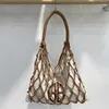 Hobo Hollow Out Slim Beach Sac pour femmes sacs à main de concepteur de luxe 2024 à la corde en toile tressé de grande capacité épaule en tissu