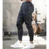 Jogger Men Carry Carry Carring Pantalones Hombres Fitness Sportswear Male Gym Gym Cargo Pantalabreut pantalones flacos 240408