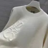 23SS新しいレディースセーター秋流行の長袖のトップハイエンドスリムプルオーバーコートデザイナーセーター女性ホワイトシンニットセーター