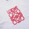 T-shirt de concepteur fluorescent rose en vrac à manches courtes avec des lettres brodées sur le cou rond, le style des couples unisexes