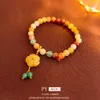 NOUVEAU BRACEULET DE FLOWER JADE GREEN DONGLING GREEN STYLE avec une sensation de conception de niche, un nouveau tempérament et des bijoux faits à la main pour les femmes