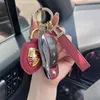 Luxury Bling Design Auto Car Logo Key Shell FOB Shell Clee Clé Clé Clé Mélange Protecteur Porte-clés avec clés de trèfle en cuir pour Porsche Macan Cayenne Panamera Cayman, etc.