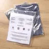 Stobag 50pcs透明なジッパーバッグの服の包装警告語の密閉された透明なジップロックシャツストレージ再利用可能なポーチ