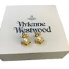 Designer Viviane Westwood High Version Impératrice Dowagers Dowagers Ship Anchor Saturn Perle Oreads Personomalie Femed Punk Temperament Temperament Boucles d'oreilles et boucles d'oreilles