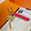 Keychain Designer Letter V Gara di pacchetti Luxury Ladies Lettera L Car Donne Coconut Palm Classico Accessori di moda