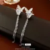 Zirkon vlinder Tassel Instagram -stijl modieuze en elegante hoogwaardige oorbeen clip internet rood veelzijdige nieuwe ooraccessoires voor vrouwen