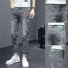 Inverno nuovi jeans angosciati maschili gusgings slim fit 2023 Nuova versione coreana Trendy Versatile maschile versatili pantaloni ritagliati