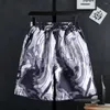 Roupas de piscar de piscar de pilotos de traje esportivo casual tie tying estampo time com camisa de manga curta shorts de perna larga para escritório de festas ou desgaste do verão