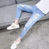 Les jeans masculins ont déchiré le sprincement neuvième denim de loisirs de style coréen