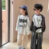 T-shirt 2024 Spring Boys and Girls Cartoon Letters Cotton T Shirts Kids Of Ock Sciose Long Sleeve Tops 240410