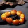 Bracelets de charme mine d'origine Bracelet de cire de miel authentique avec demi-peau Amber Bouddha perle des hommes et des femmes