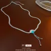 Titanium Steel Turquoise Fan en forme de collier à glands, personnalité de la mode de niche, chaîne de clavicule, sens simple et haut de gamme, collier pour femmes