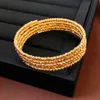 Verklig guldelektropläterad flerskikts öppna armband fashionabla armband, liten high end och elegant hantverk för kvinnor