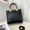 Bolso de diseño de lujo Nuevo bolso simple y de moda Mujeres Patrón de vaca de alta calidad Hombres Damas Tota de bolsas Paquete de bolsas