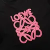 T-shirt de concepteur fluorescent rose en vrac à manches courtes avec des lettres brodées sur le cou rond, le style des couples unisexes