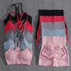 Solidne kobiety dwuczęściowe zestawy brzoskwini Błośne spodenki Kobiece Trackus Gym Zestaw Set Kanter Fitness Szorty Push Up Bra Summer 240410