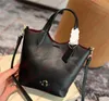 Femmes Coa Hanna Baquet sac fourre-tout Designer Shopping Handsbag Hand Quality High Quality Crossbody Mobile Phone Sacs Portefeuille Hobo Bourses Hobo Capsais en forme de cartouches