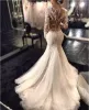 2024 Gorgeous Mermaid Wedding Dresses Dubai African Arabic Style Long Sleeves Lace Bridal Gowns Fishtail Button Back Wedding Dress